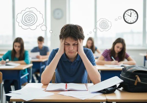 Teen feeling overwhelmed in a classroom with ADHD symptoms