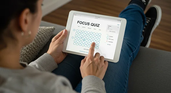 Adult taking a confidential online ADHD self-assessment quiz